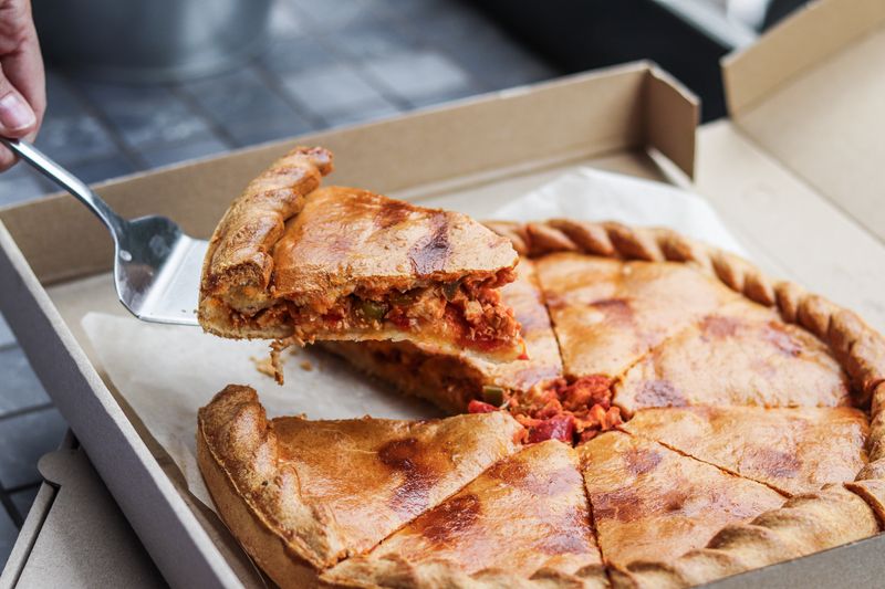 Giordanos signature deep-dish pizza with rich tomato sauce and mozzarella